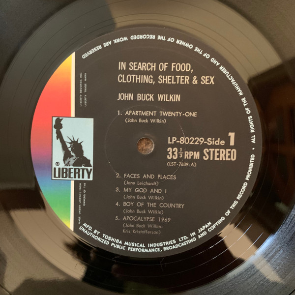 John Buck Wilkin - In Search Of Food Clothing Shelter And Sex (LP, Album)